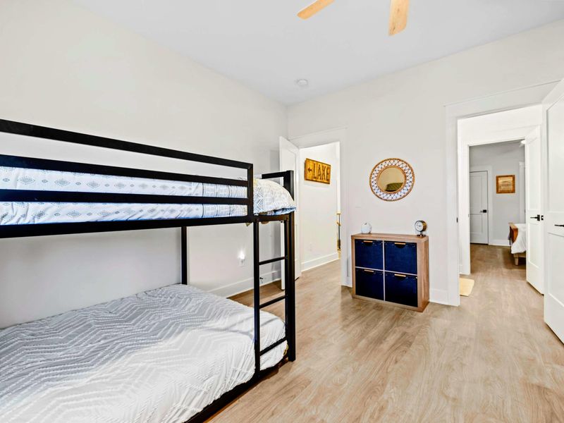 Bunk Room - Full-over-full bunks, a LAKE sign, and cubby storage make this main-level room the kids' favorite home base.