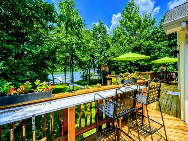 Scenic Lakeside Perch – This elevated deck area, adorned with colorful flowers and shaded by umbrellas, offers a beautiful vantage point over Lake Anna. Ideal for savoring a meal or simply taking in the serene lake views.