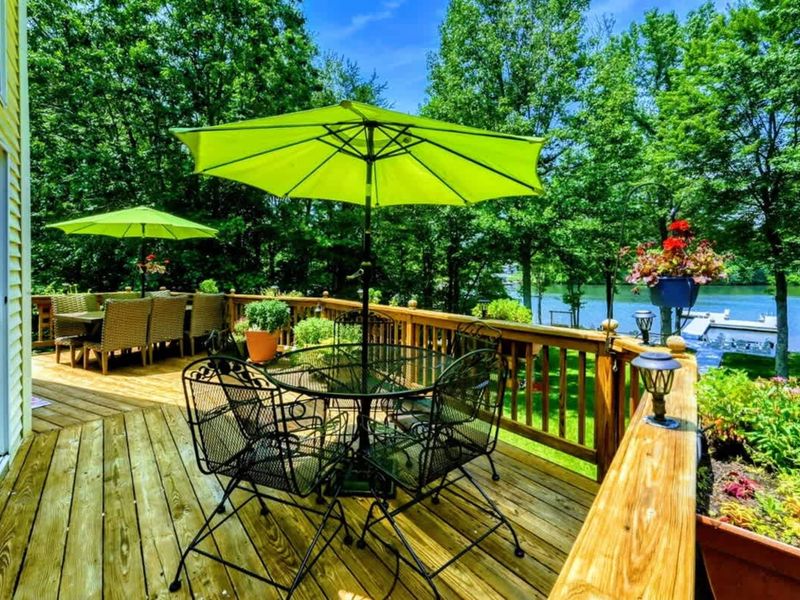 Sunny Lakeside Deck – Bask in the sun on this vibrant deck, complete with colorful umbrellas and comfortable seating, offering stunning views of Lake Anna. Perfect for enjoying a relaxing afternoon or hosting a sunny get-together.