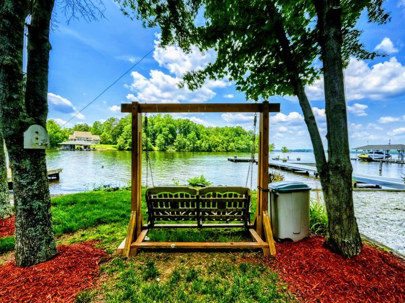 Lakeside Swing Serenity – Unwind on this charming swing, perfectly positioned for stunning views of Lake Anna. Framed by trees, it's a serene spot to enjoy the lakeside breeze and the sound of water.