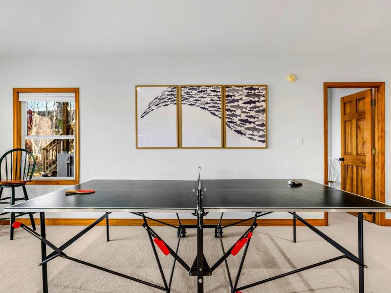 Ping Pong Corner – Challenge friends and family to a game of ping pong in this dedicated area of the game room. Bright and airy with access to the outdoors, it's the perfect spot for some competitive fun or casual play.