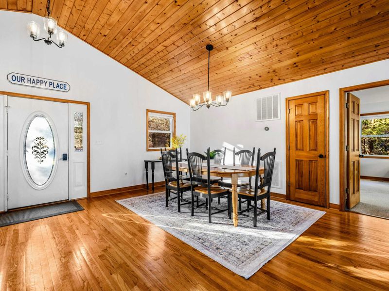 Lakeside Dining Area – This charming dining space features wooden ceilings and hardwood floors, creating a warm and welcoming atmosphere. Perfect for shared meals and memorable moments at Lake Anna, it truly is "Our Happy Place."
