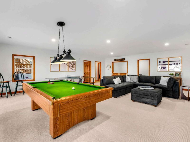 Entertainment Hub – Featuring a classic pool table and plush seating, this game room is perfect for fun and relaxation. Styled with unique lighting and tasteful decor, it’s a favorite spot for all ages.