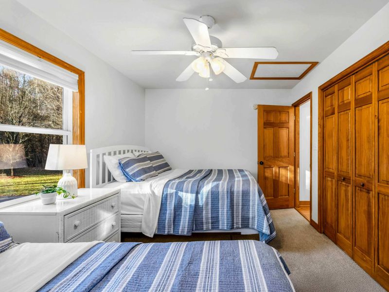 Comfortable and Spacious – Perfect for families or friends, Bedroom 3 offers generous sleeping space, warm wood accents, and plenty of closet storage to settle in with ease.