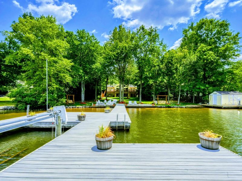 Lakeside Charm at Lake Anna – Stroll down the inviting pier, framed by lush trees, leading to a picturesque waterfront setting. Perfect for leisurely days and making lasting memories.