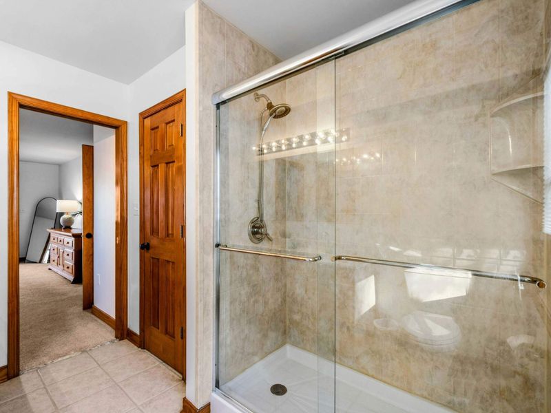 Tiled Walk-In Shower – Refresh and recharge in the spacious glass-enclosed shower, featuring sleek tilework and modern finishes that elevate your everyday routine.