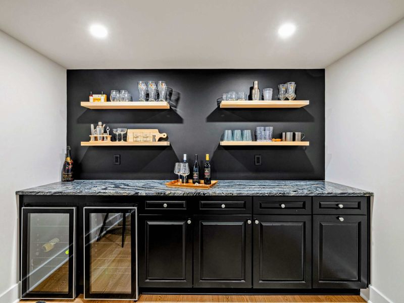 Sip, Serve, and Unwind – This sleek lower-level bar is perfect for prepping cocktails, mocktails, or midnight snacks.