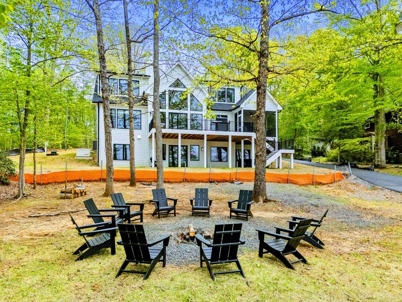 Gather Beneath the Stars – Just steps from the back door, this fire-lit circle blends lakeside comfort with woodland calm.