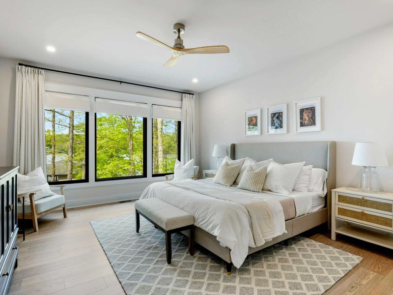 Primary Suite Sanctuary – A restful retreat on the main floor, complete with lake views, luxurious linens, and space to truly unwind.