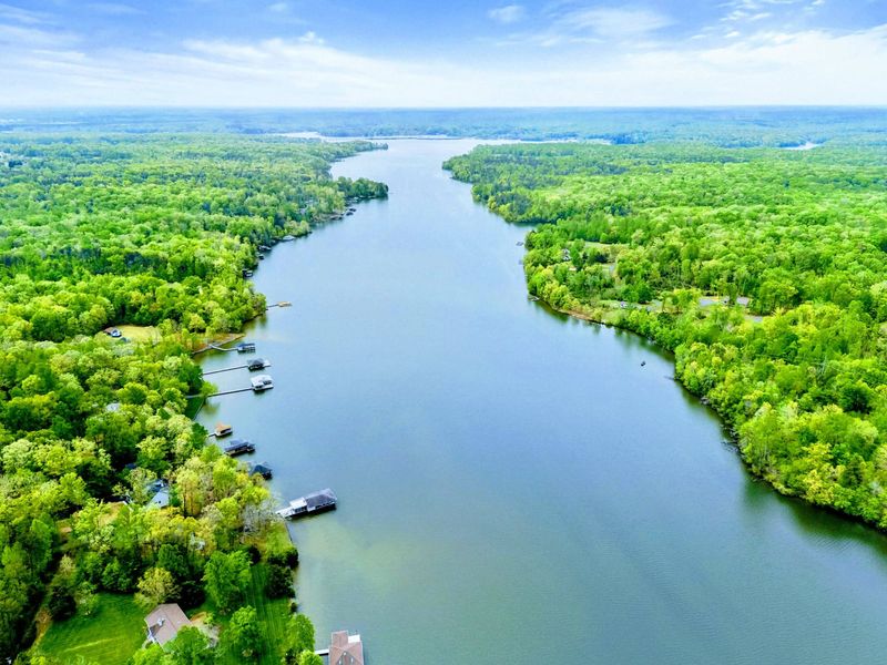 Aerial - Lake Anna's broad waterway with forested shorelines stretching to the horizon.