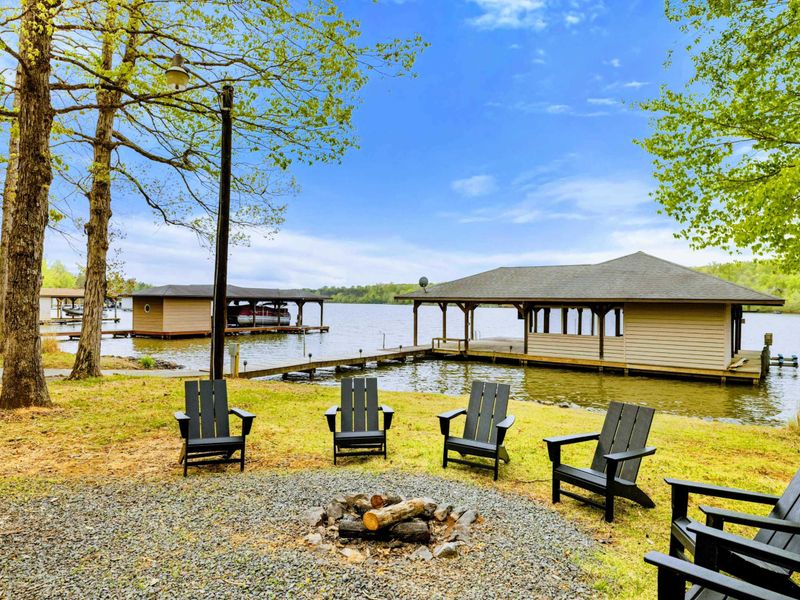 Firelight & Lake Views – As the sky fades and embers glow, this is where your evening truly begins.