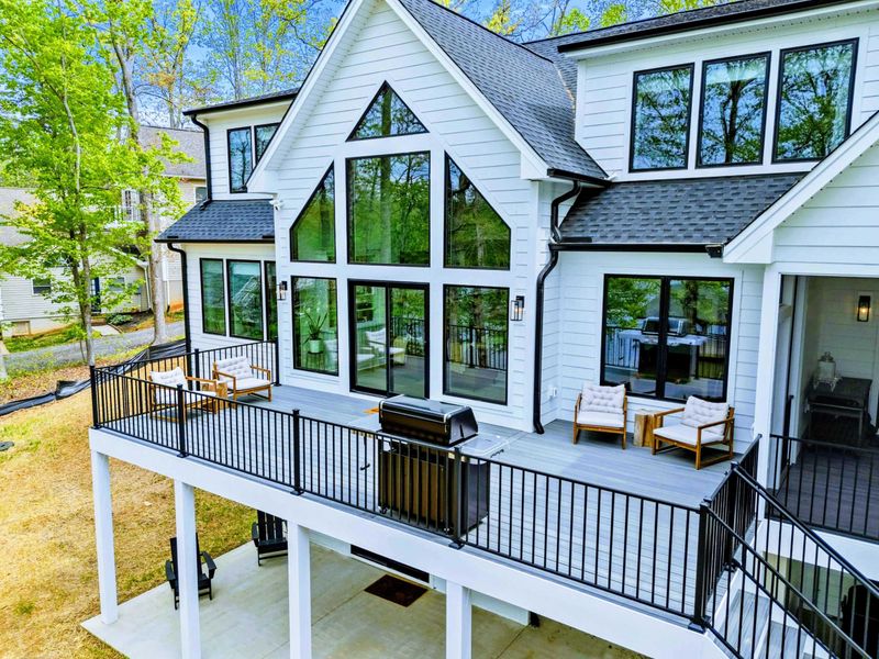 A Deck with a View – Framed by tall windows and treetops, this elevated space invites long lunches, lazy mornings, and golden hour gatherings.