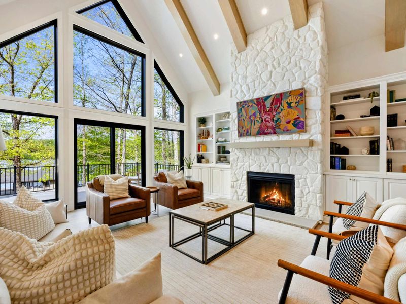 Gathered in the Light – Beneath vaulted ceilings and framed by lake views, this room was made for connection and calm.