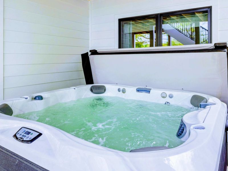 Quiet Indulgence – Crystal-clear water, bubbling warmth, and a space designed for pure relaxation—any time of day.