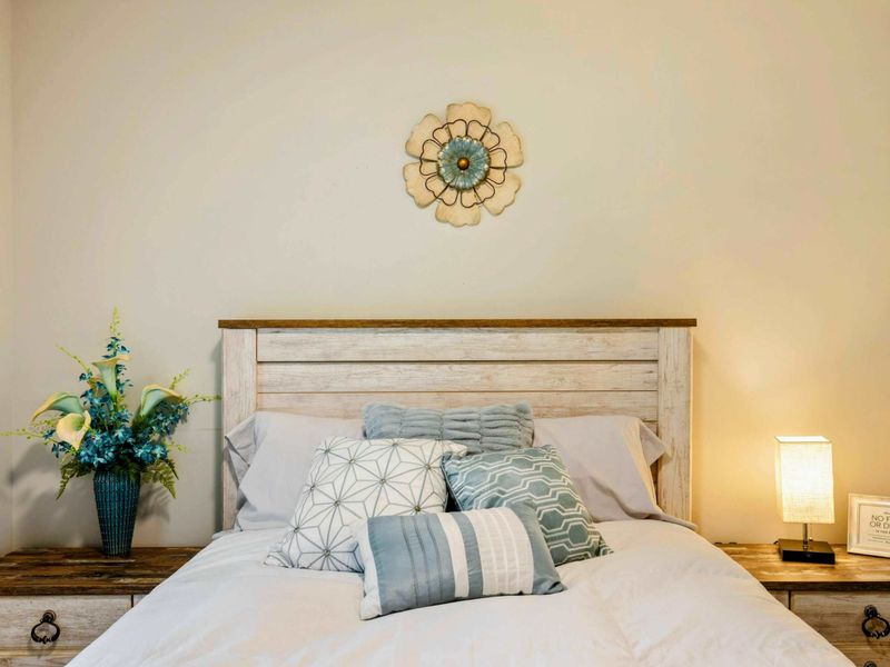Where Style Meets Stillness – Cozy bedding and soft lighting for a peaceful night’s sleep.