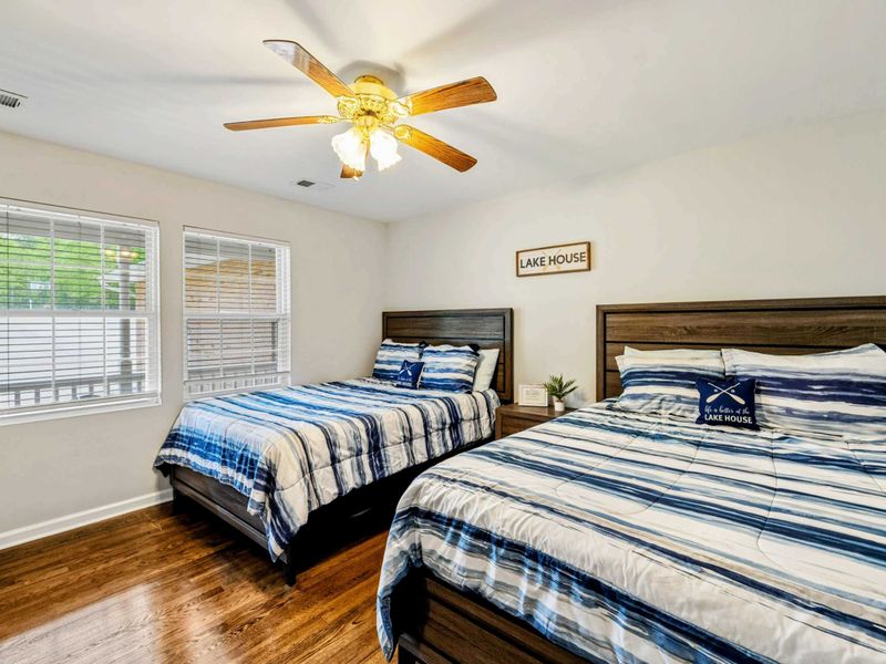 Perfect for Sharing and Sleeping In – Two cozy beds and plenty of sunshine make this a guest favorite.