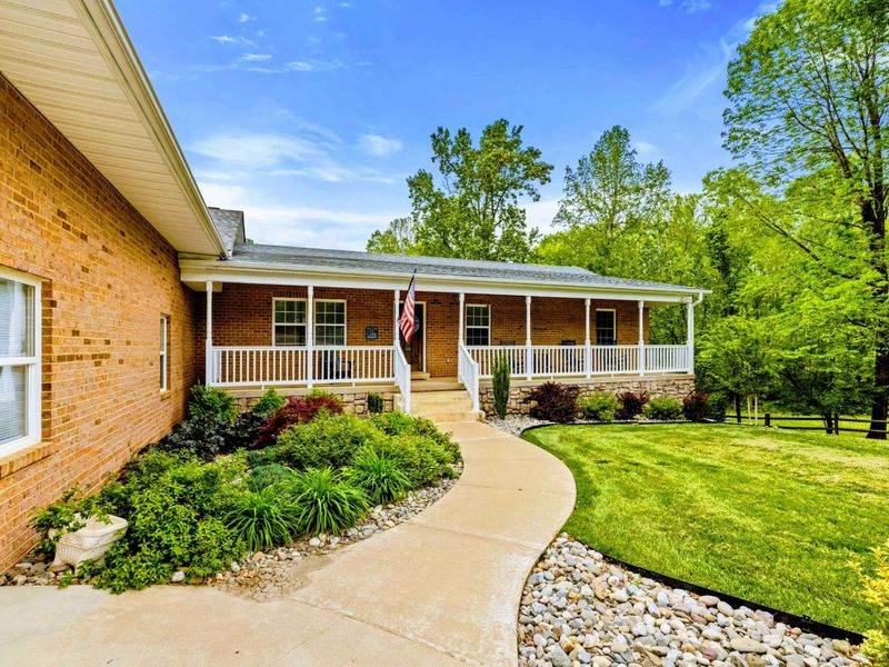 Where the Welcome Begins – A front porch that says, “come in, kick back, stay a while.”