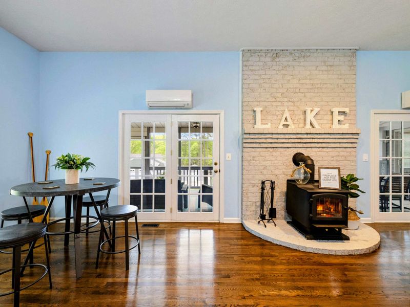 Where Comfort Finds Its Glow – Gather near the fire, toast your day, and let the lake spirit linger.