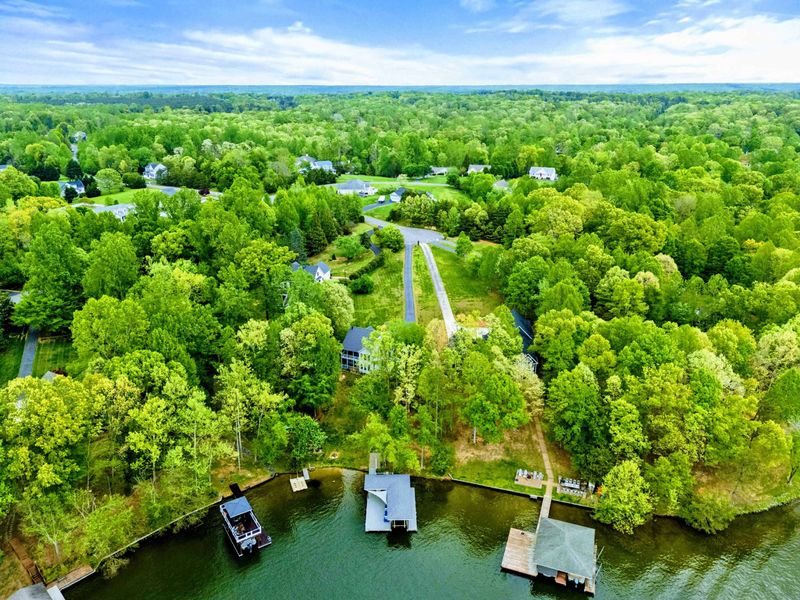 Lake Life Starts Right Here – Tucked among trees with the water just beyond, this home delivers peace, privacy, and play.