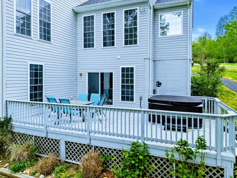 Morning Coffee, Evening Soak – From laughter around the table to quiet time in the hot tub, this deck does it all.