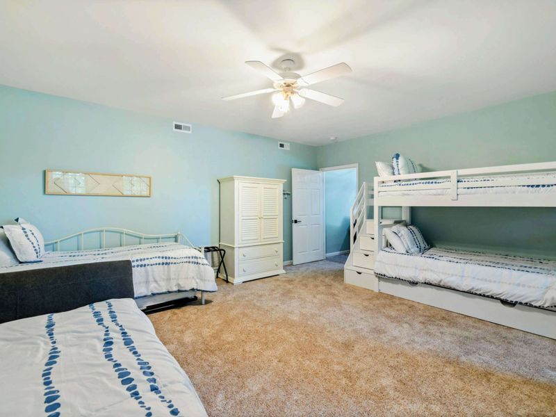 Where Sleepovers Never End – With bunks and beds for all, this room was made for giggles, games, and great memories.