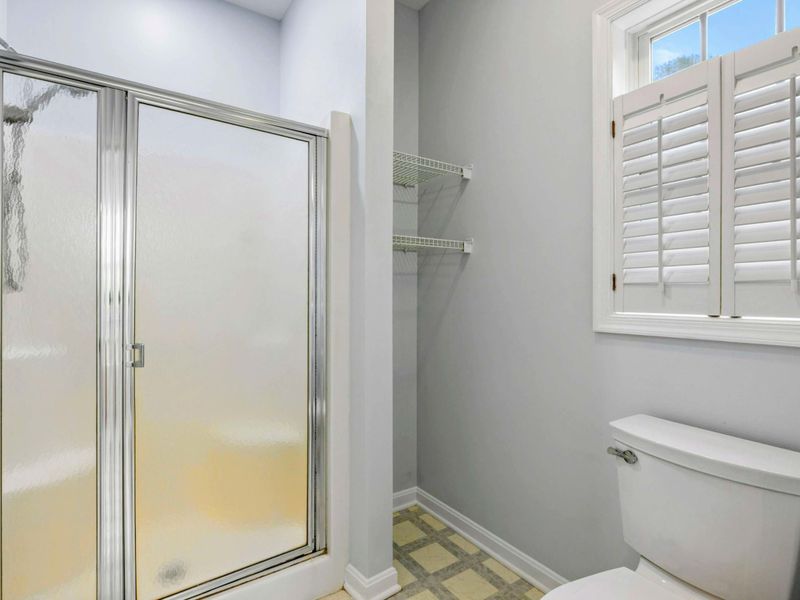 Bright, Clean, and Convenient – A private shower and sunny window make this space feel fresh and functional.