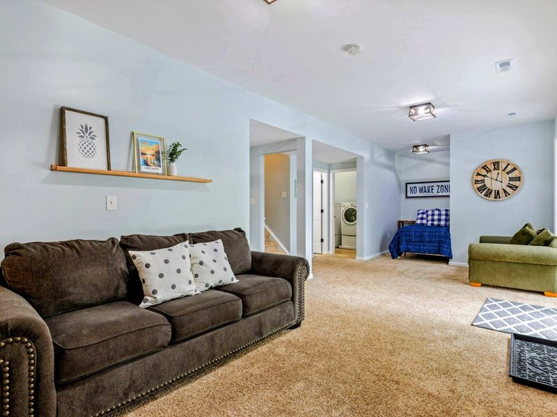 Room to Relax, Together – With flexible seating and space to sprawl, this lower level is made for connection and comfort.