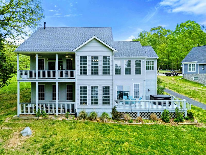 All Together, All in View – With porches, decks, and windows at every turn, this home keeps you close to what matters.