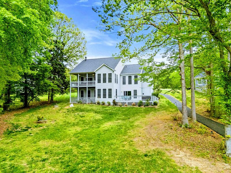 Your Gathering Place Awaits – Wrapped in trees and filled with light, this home is ready for your favorite people.