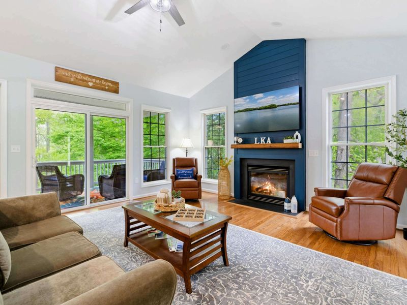 The Best Kind of Gathering Space – Big windows, soft seats, and a fireplace that invites everyone to stay a little longer.
