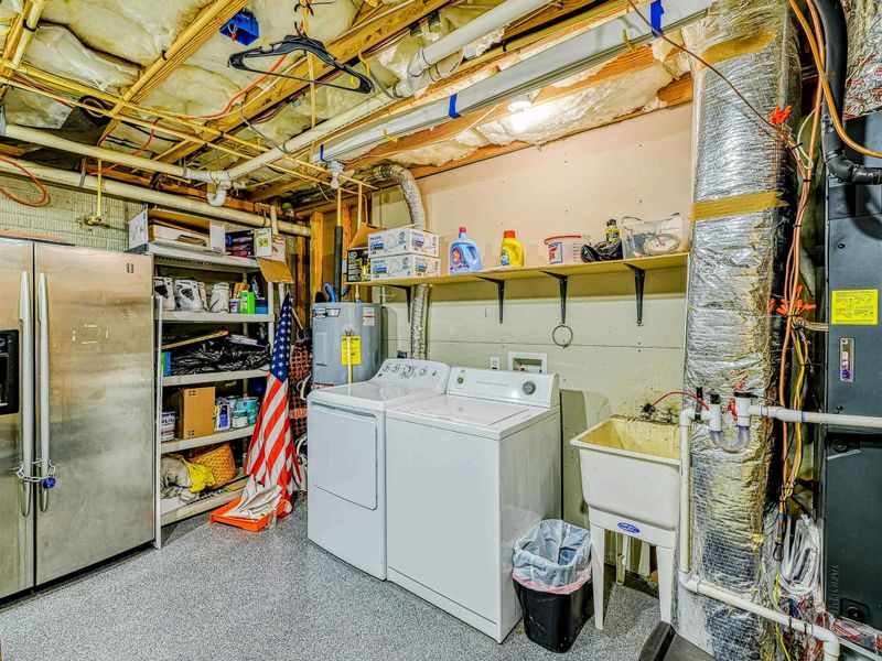 Laundry Room - Full-size washer and dryer with extra stainless refrigerator and utility shelving.