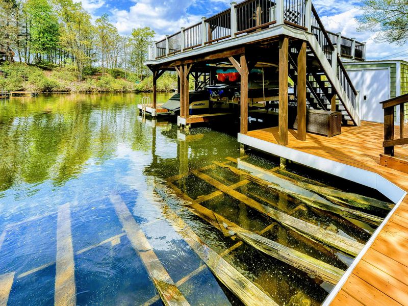 Dock - Two-level dock with boat lift below, stairway, and sundeck gazebo above on the cove.