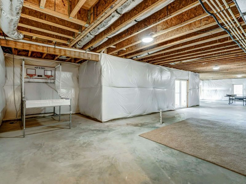 Let the Games Begin – With ping pong, pop-a-shot, and space to spare, this basement is made for friendly competition.