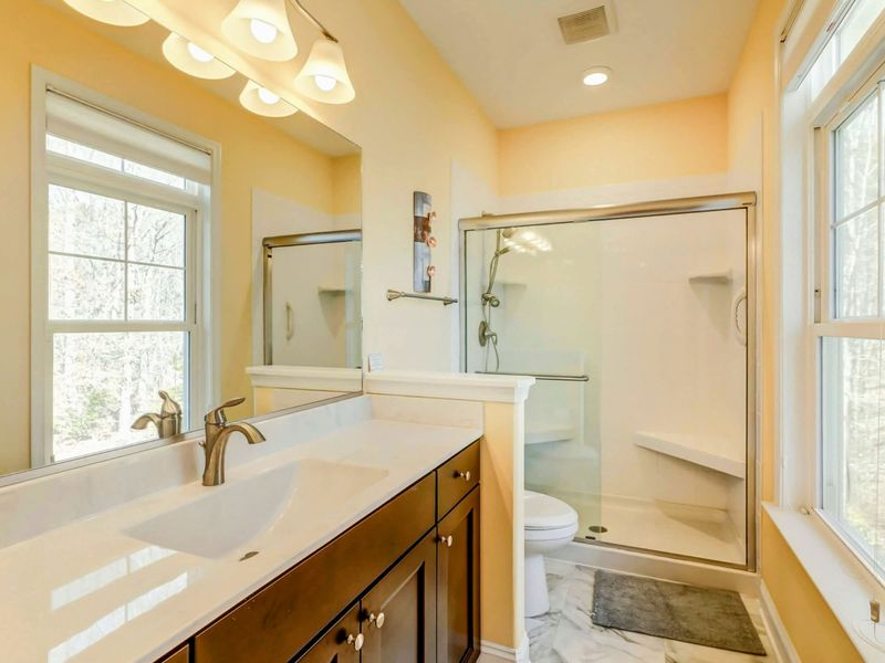 Clean, Bright, and Just for You – This attached bath gives guests the comfort of their own space—no sharing required.
