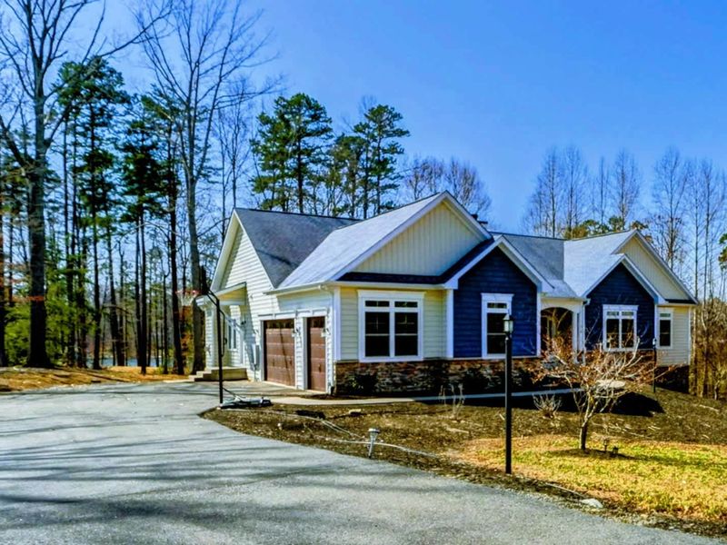 Your Lakeside Welcome – From the moment you pull in, this home invites you to slow down, settle in, and soak it all up.
