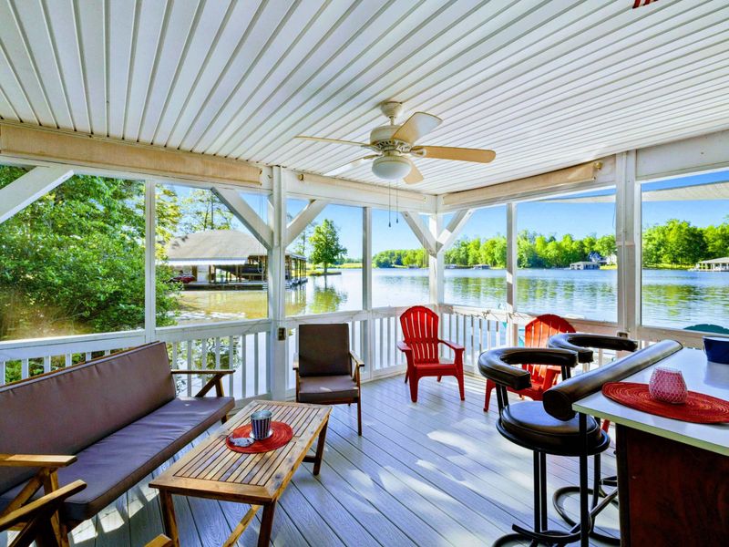 Stay Cool, Stay Connected – Enjoy peaceful lake views and easy conversation from this shaded, open-air retreat.