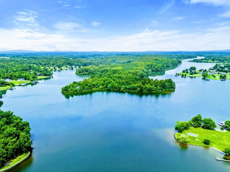 Lake Anna - Blue mountains frame the horizon as Lake Anna stretches out in every direction, with wooded islands and calm water as far as the eye can see.