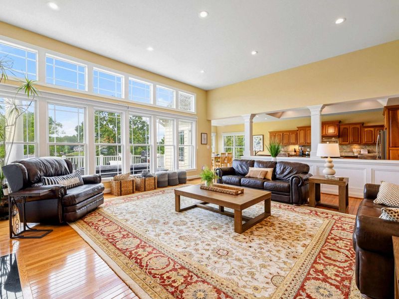 Great Room - Leather sofas, a large area rug, and an open layout flowing into the kitchen create a comfortable gathering space.