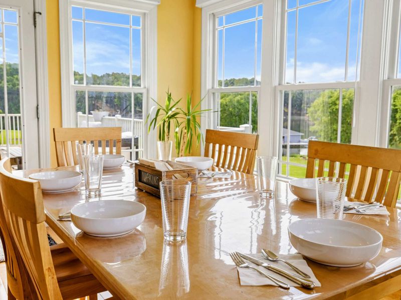 Table Setting - Place settings catch the morning light in the breakfast nook, a bright and inviting spot for every meal.