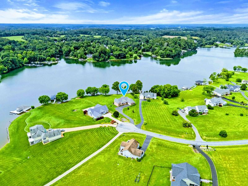 Aerial View - The cul-de-sac location and expansive green lot give the property a sense of space and privacy steps from the water.