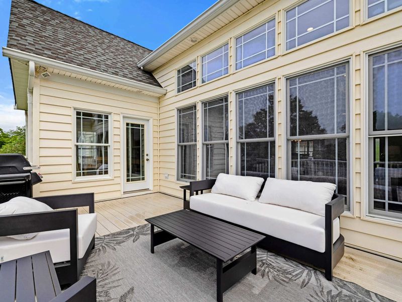 Deck Lounge - Comfortable outdoor furniture and a gas grill tucked against the house, ready for easy outdoor entertaining.