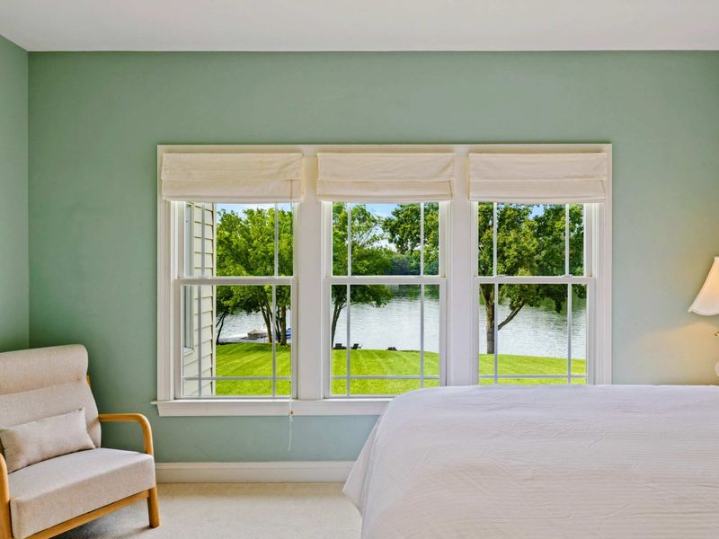 Lake View Bedroom - The view from the bed looks out to the lawn, shade trees, and Lake Anna, a true waterfront wake-up.