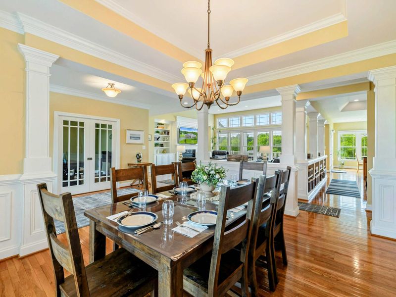 Formal Dining - French doors to the office and a clear sightline to the great room keep the space connected and open.