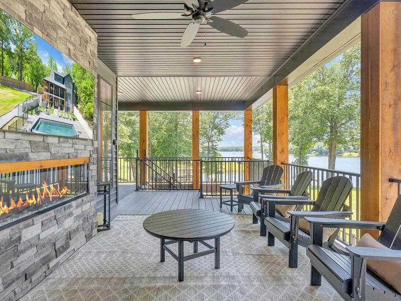 Main Level Covered Porch with Fireplace and TV