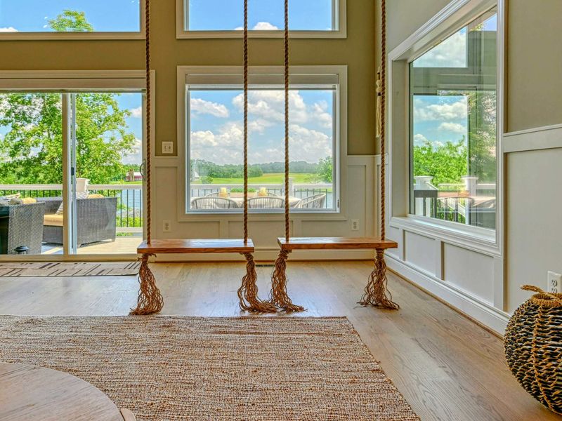 Lakefront Windows - Floor-to-ceiling glass frames the water from every seat, keeping the view with you all day long.