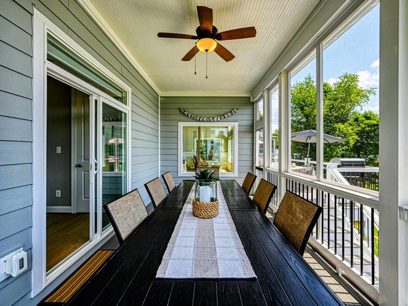 Indoor Comfort, Outdoor Feel – Long meals, easy laughter, and the lake just beyond the screens.