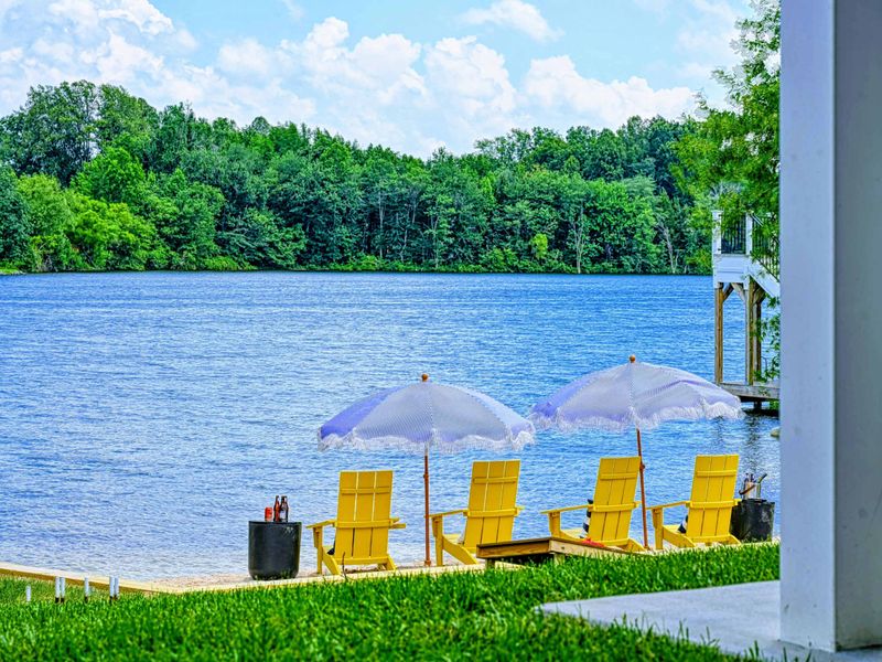Shaded Beach - Yellow chairs tucked into a cool corner of the beach for slow afternoons and long conversations by the water.