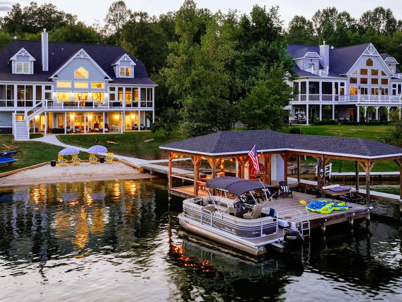 Lakefront, Beautifully Lit – An elevated evening view where comfort and design meet the shoreline.