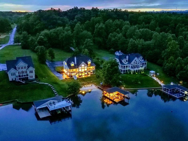 Evening Glow on the Private Side – The lights come on, the lake goes still, and the whole shoreline feels beautifully at ease.
