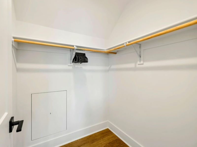 Bedroom 5 Closet - A walk-in closet with ample hanging space and an access panel provides convenient storage for this suite.